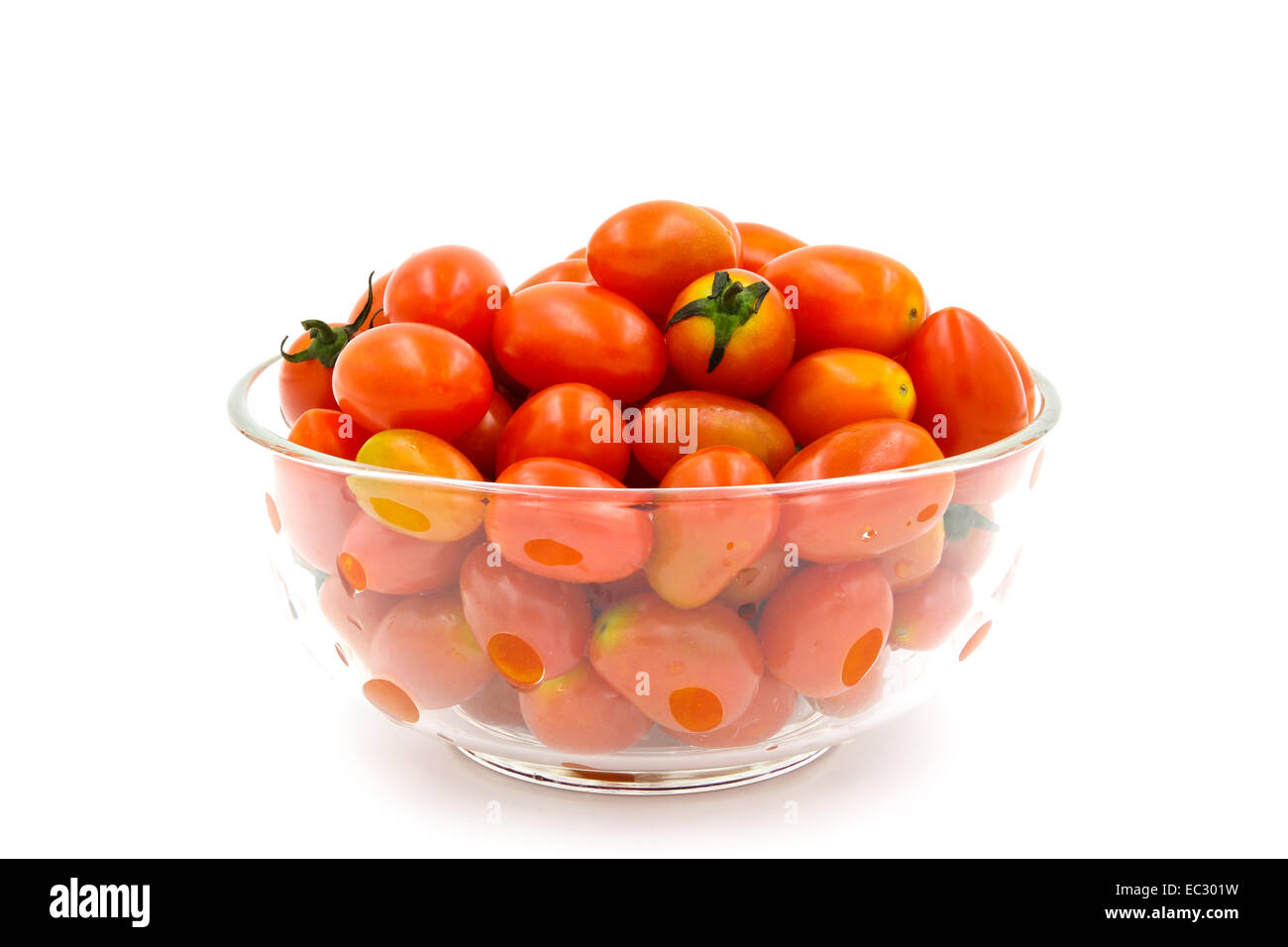 Cherry tomatoes in a glass bowl on white background Stock Photo - Alamy