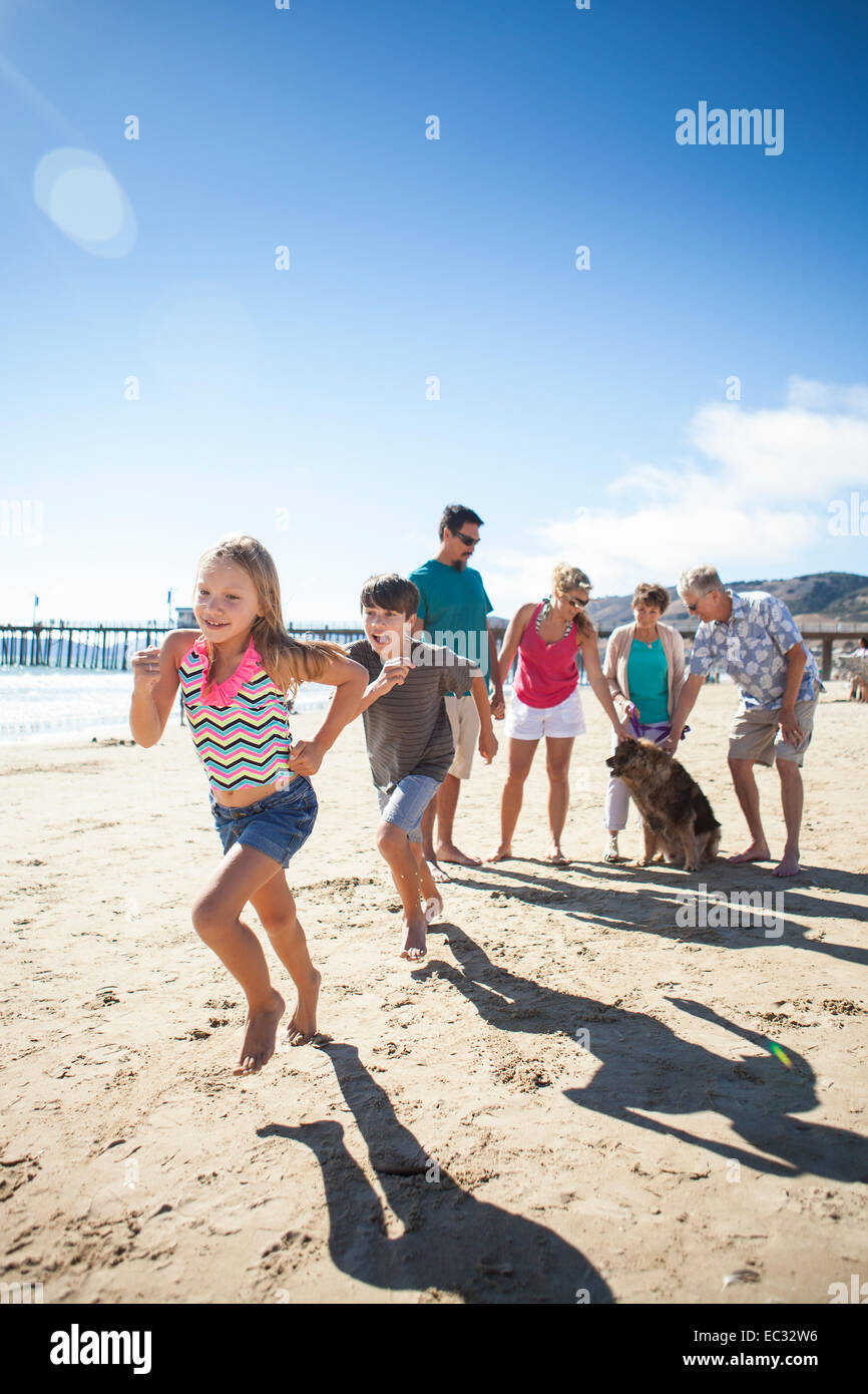 Family takes a stroll on the beach, Pismo Beach, Central Coast