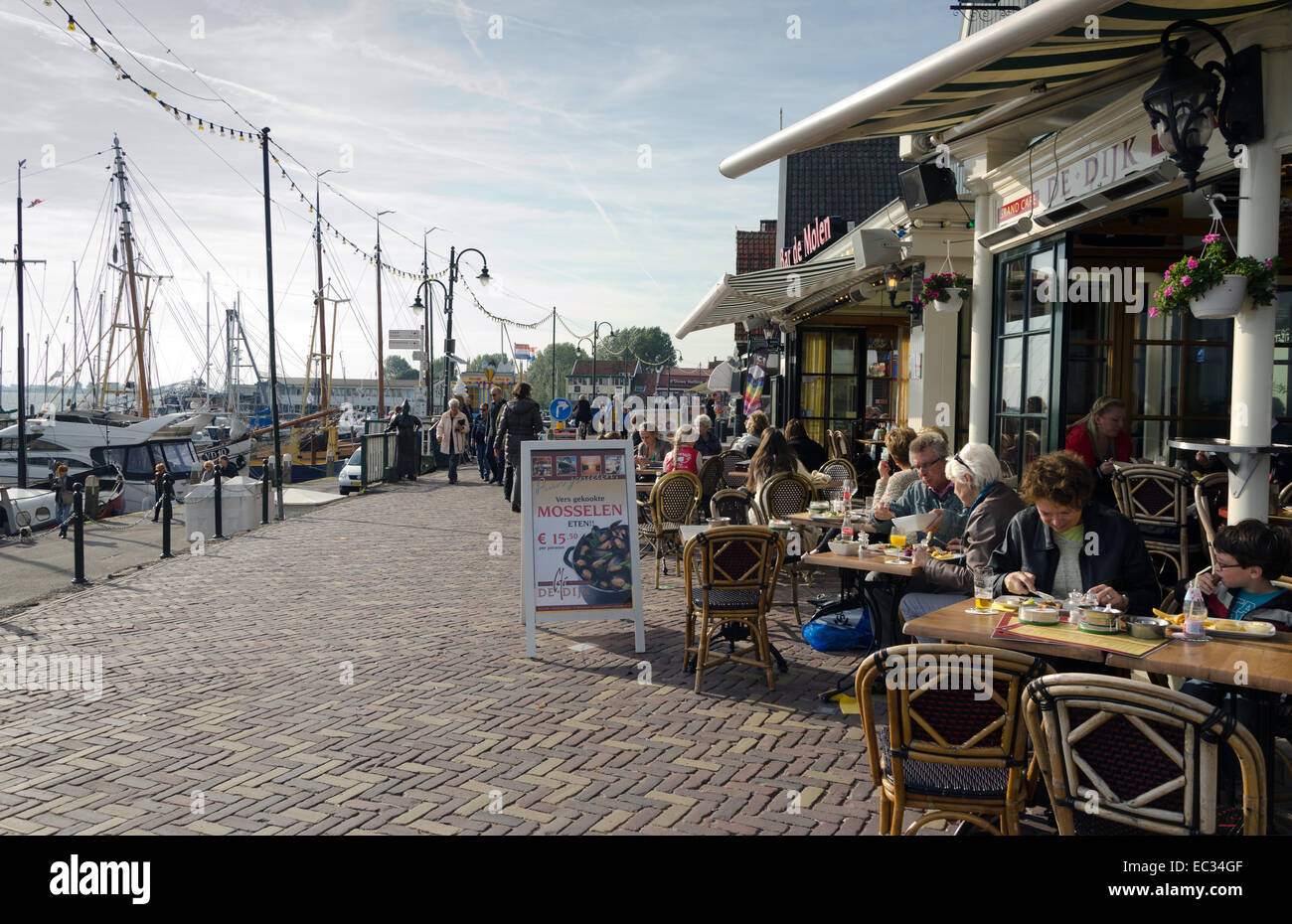 VOLENDAM, NETHERLANDS - OCTOBER 22: A view of a street of Volendam on October 22, 2013. Volendam is world famous thanks to its t Stock Photo