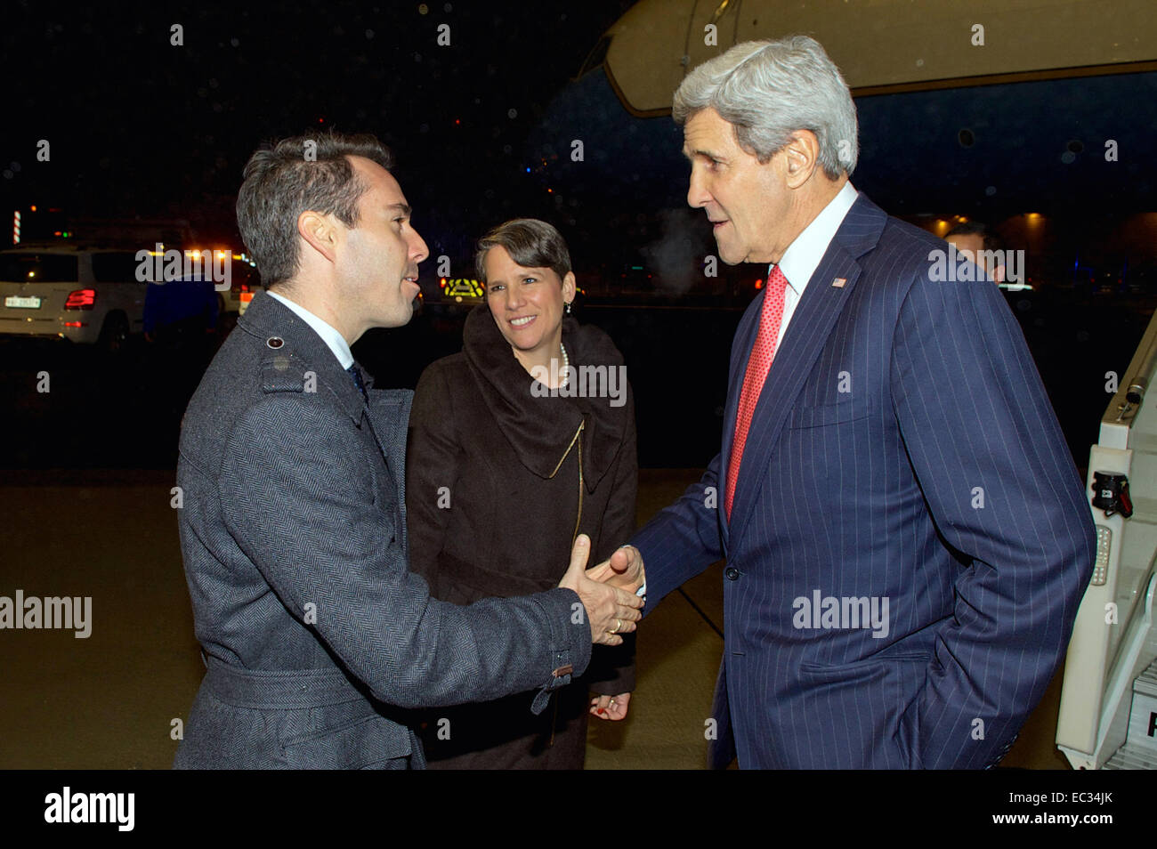 U.S. Ambassador to the Organization for Security and Cooperation in Europe Daniel Baer, joined by U.S. Ambassador to Switzerland Suzan &quot;Suzi&quot; LeVine, greets U.S. Secretary of State John Kerry as he arrives in Basel, Switzerland, on December 3, 2014, for a series of OSCE meetings. Stock Photo
