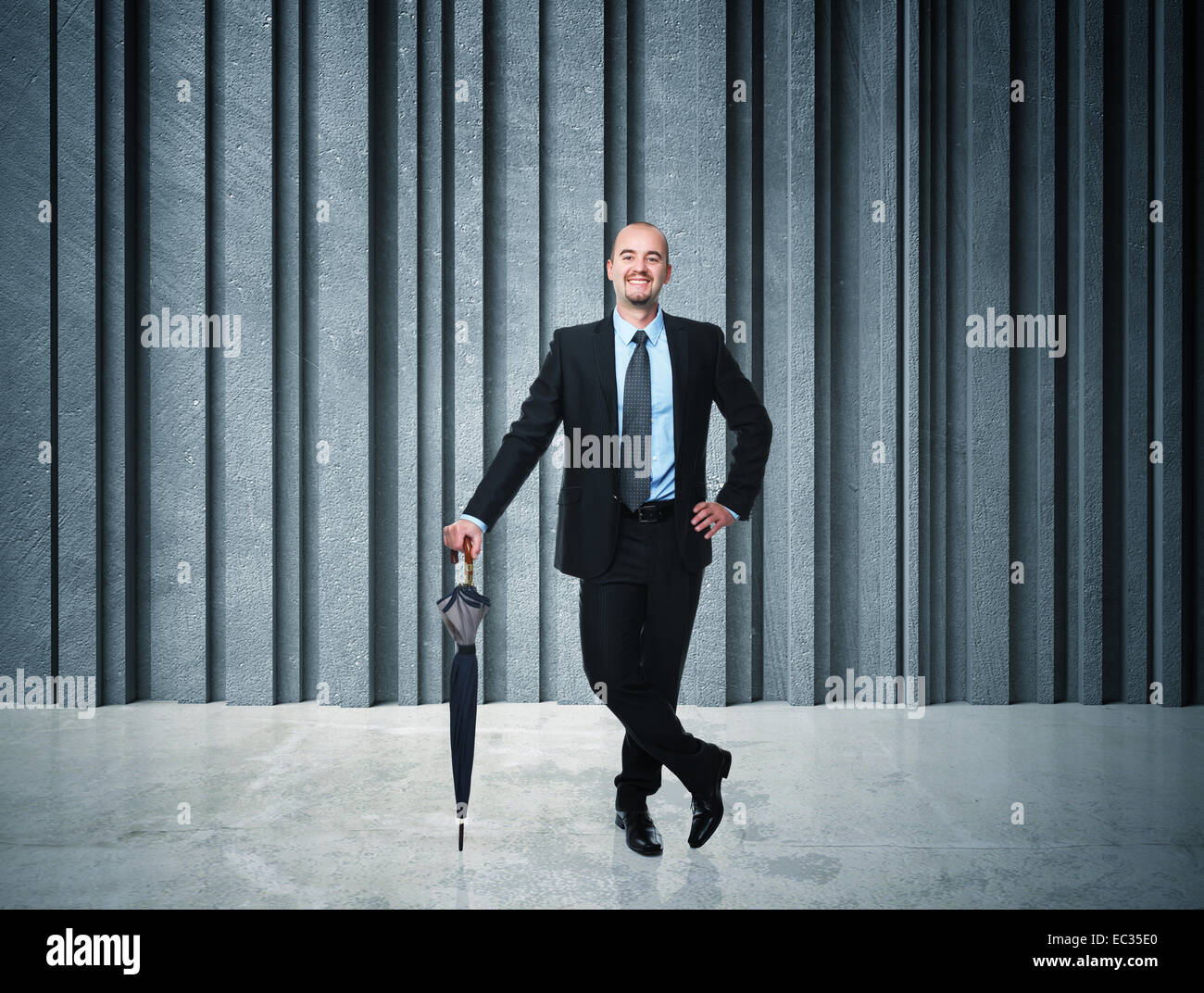 positive businessman and concrete background Stock Photo