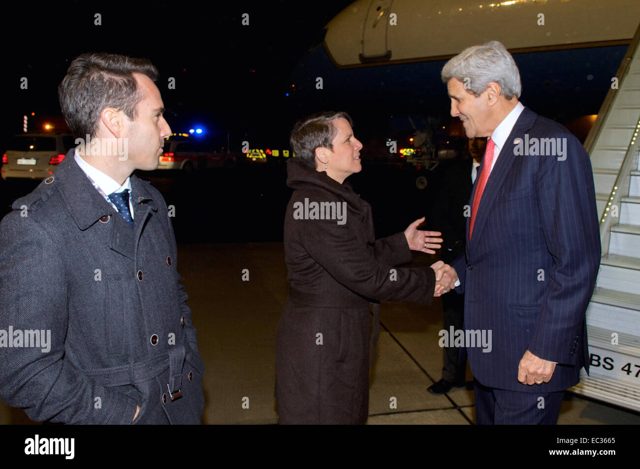 U.S. Ambassador to Switzerland Suzan &quot;Suzi&quot; LeVine, joined by U.S. Ambassador to the Organization for Security and Cooperation in Europe Daniel Baer, greets U.S. Secretary of State John Kerry as he arrives in Basel, Switzerland, on December 3, 2014, for a series of OSCE meetings. Stock Photo