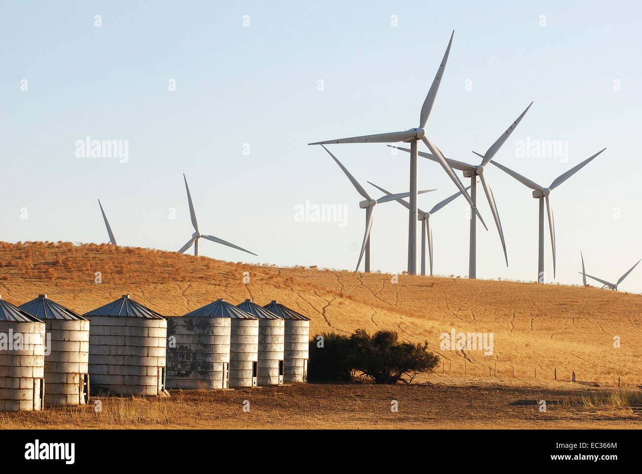 Wind farm with agricultural silos Stock Photo