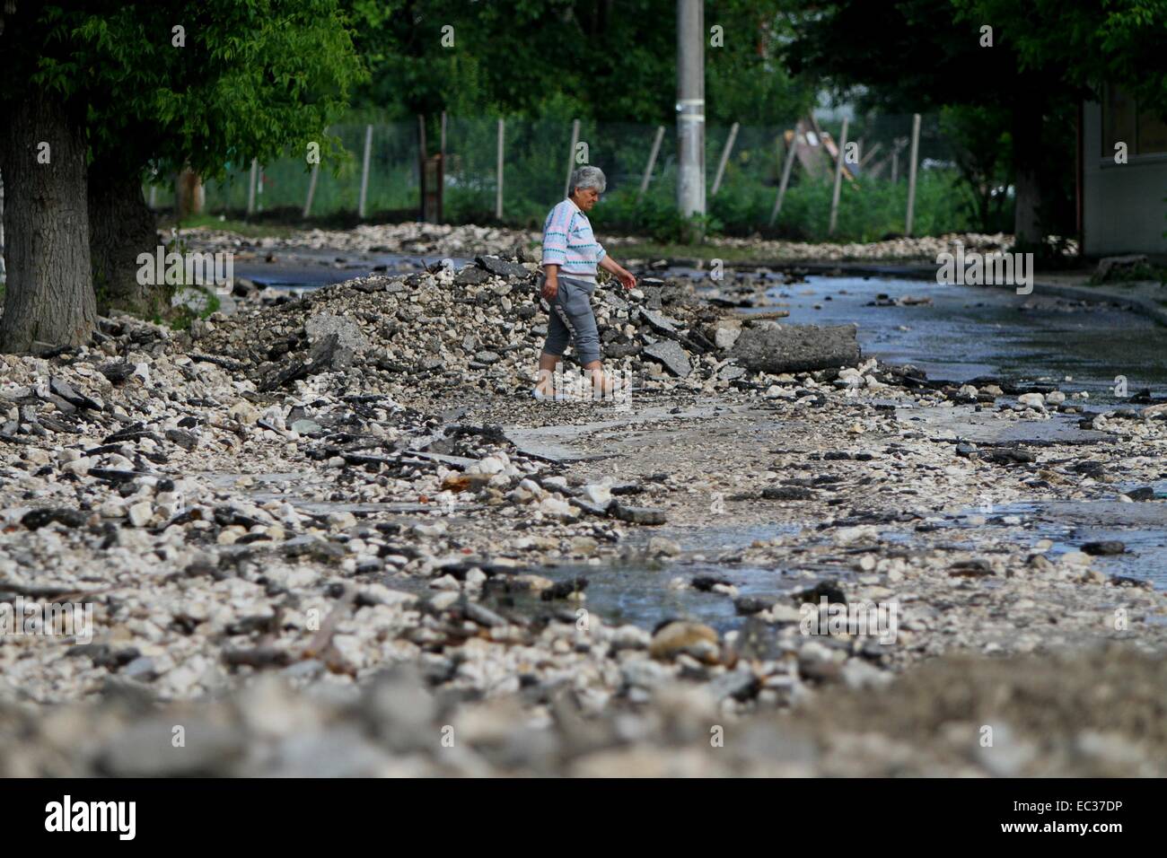 Torrential rain throughout Bulgaria has caused severe flooding, destroying thousands of homes and cars. Doliste is one of the worst hit villages, where a small river overflowed during the night sending a three-foot wave crashing through the streets. About Stock Photo