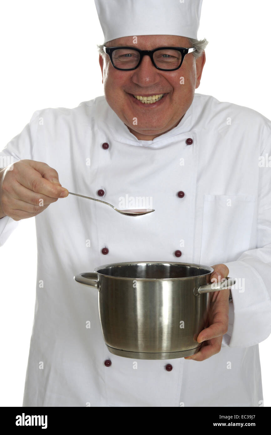 A cook tastes the meal and smiled Stock Photo