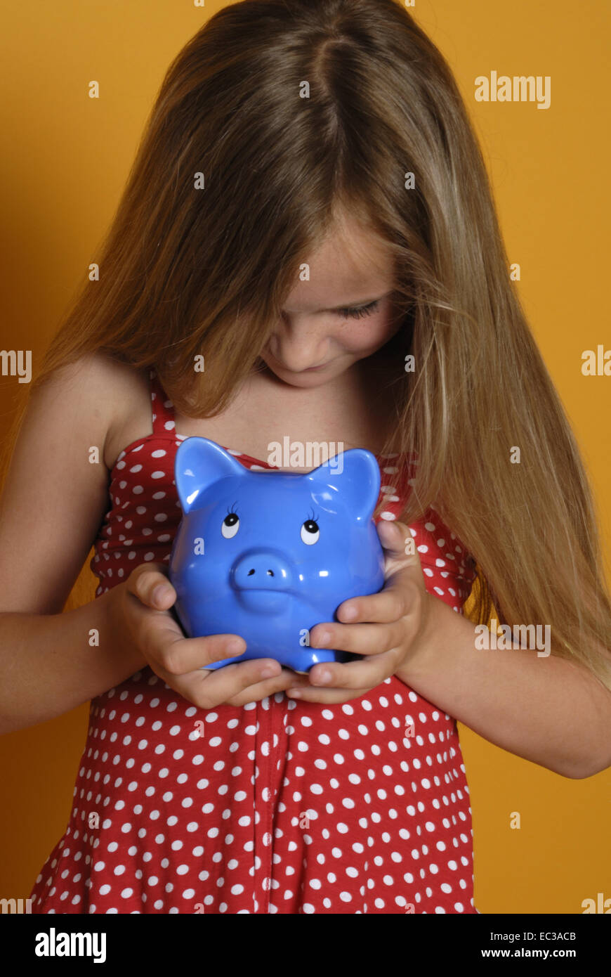 Girl with Piggy Bank Stock Photo - Alamy