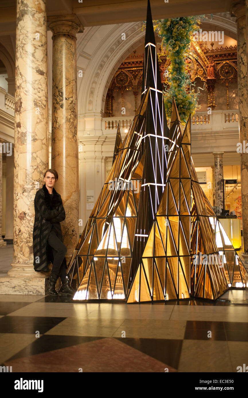 The V&A, London, UK. 9th December, 2014. British fashion designer Gareth Pugh and his Christmas Tree installed in the Grand Entrance at the V&A. Ceremony stands at over 4m high and mirrors the shape of the traditional evergreen tree. Credit:  Malcolm Park editorial/Alamy Live News Stock Photo