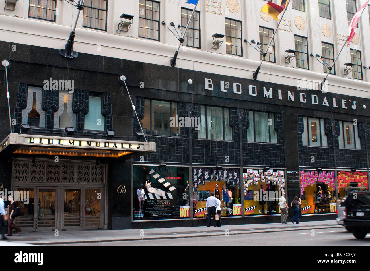 Shoppers pass by Bloomingdale s department store in Manhattan New York USA. Bloomingdale's Storages. 1000 3rd Avenue to 59th Str Stock Photo