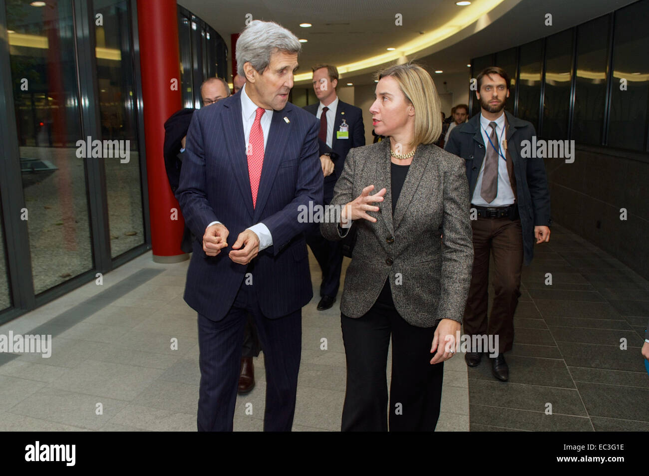 U.S. Secretary of State John Kerry walks with European Union High Representative for Foreign Affairs Federica Mogherini before a wide-ranging meeting on December 3, 2014, at the headquarters of the E.U. External Action Service in Brussels, Belgium. Stock Photo