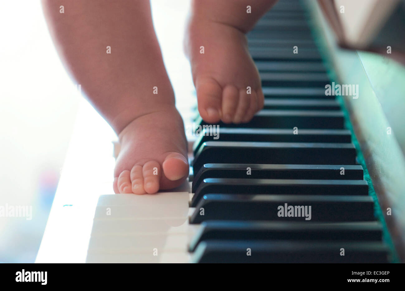 Baby playing Piano Stock Photo - Alamy