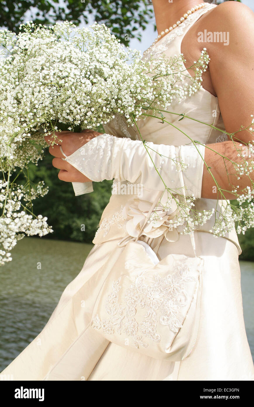 Bride carrying Bouquet of Flowers Stock Photo Alamy