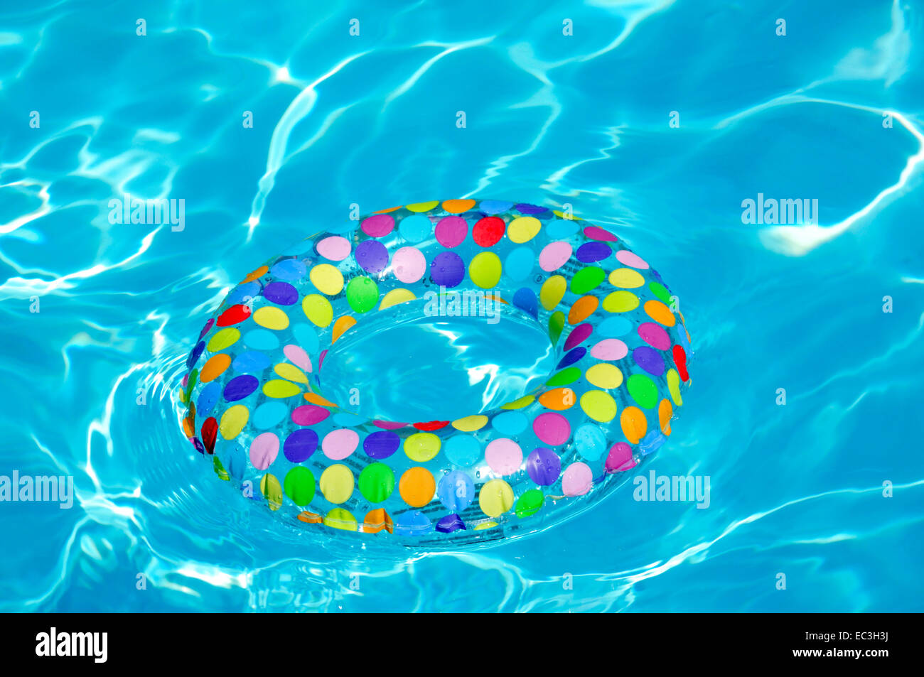 Swimmingpool with floating tire Stock Photo