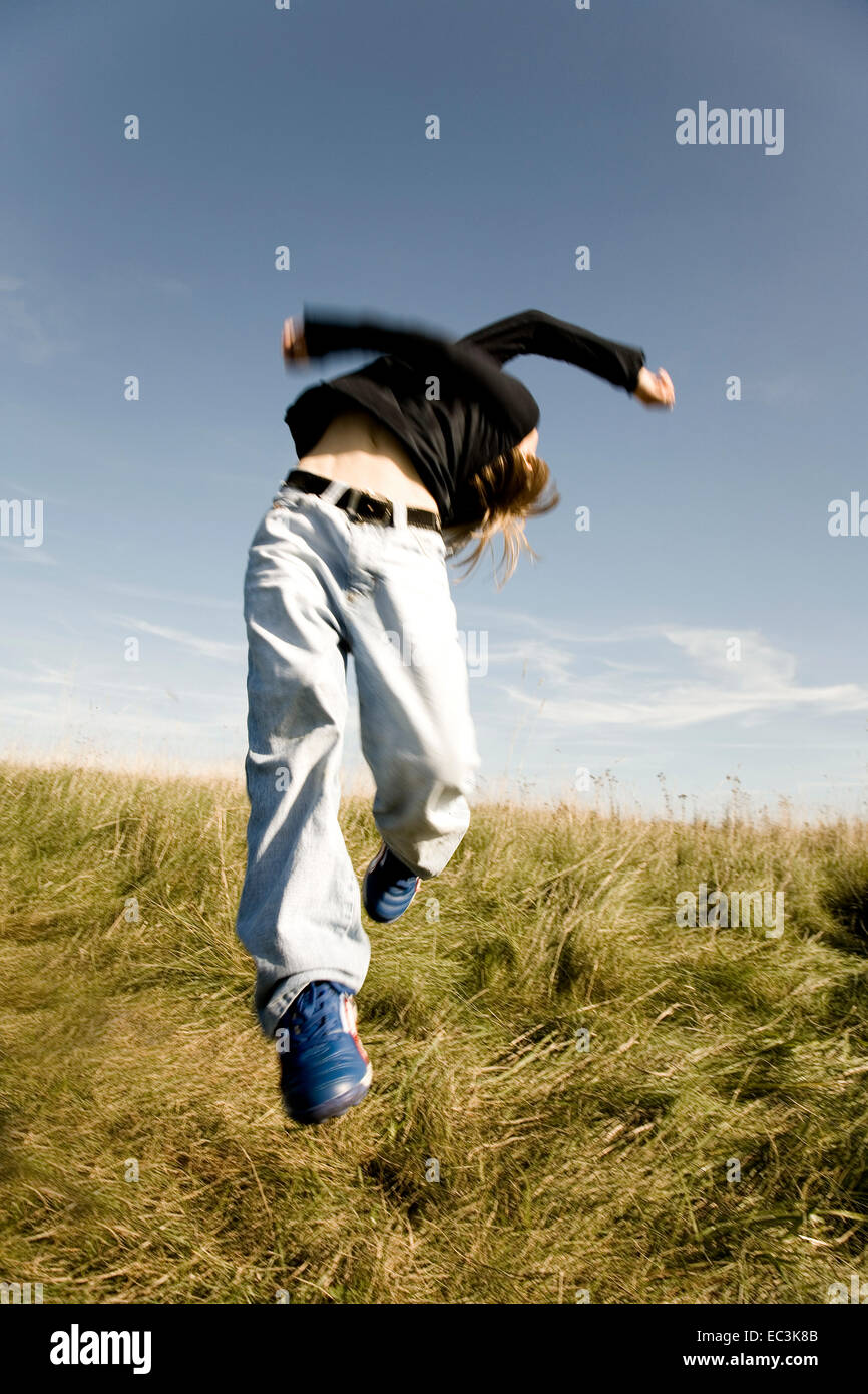 Boy cutting a Caper Stock Photo Alamy
