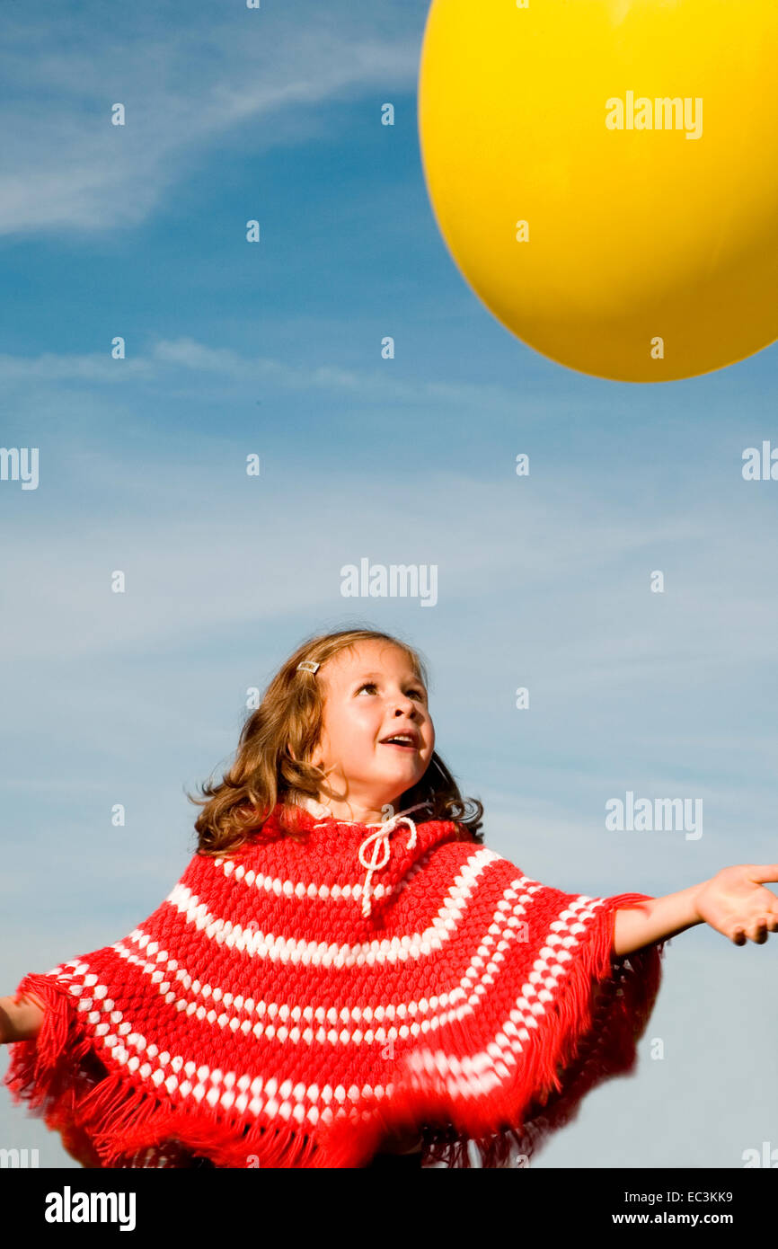 Girl with yellow Balloon Stock Photo - Alamy