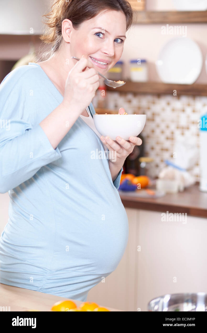 Pregnant Woman eating Cereals Stock Photo Alamy