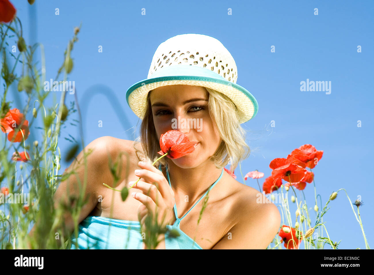 Woman sitting in Meadow Stock Photo - Alamy