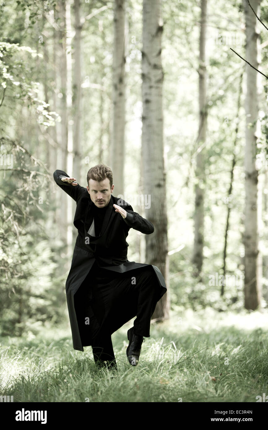 Man black coat in forest hires stock photography and images Alamy