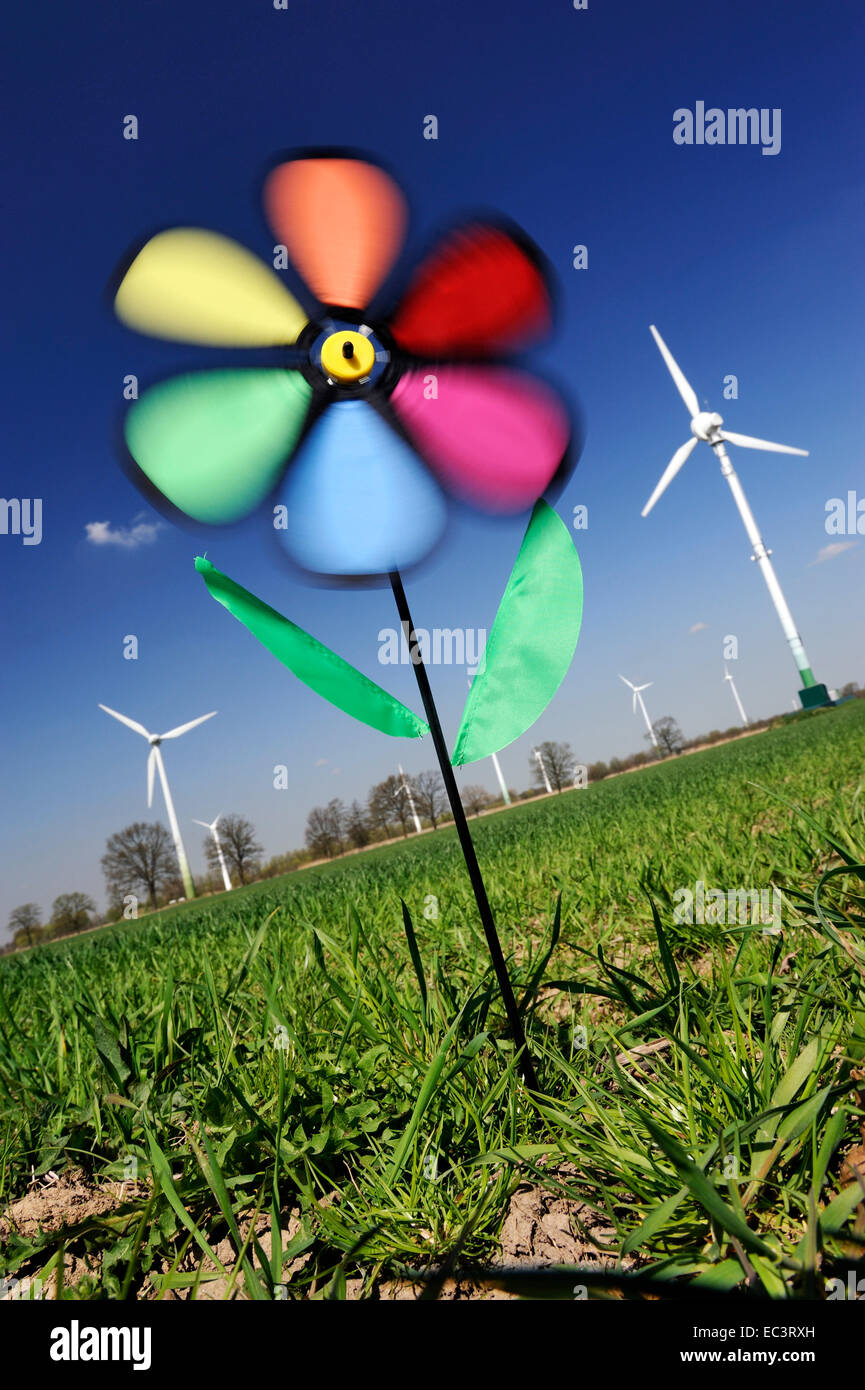 Toy wind wheel in front of wind wheels, wind power Stock Photo