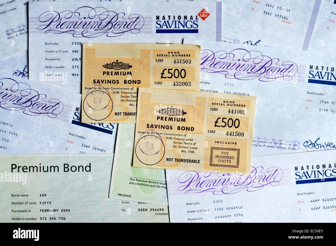 A variety of styles of Premium Savings Bond certificates from 1970s to 2004. Stock Photo