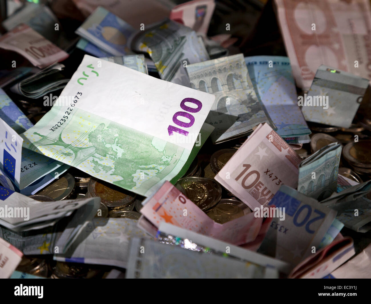 Stack of Euro banknotes and euro coins Stock Photo - Alamy