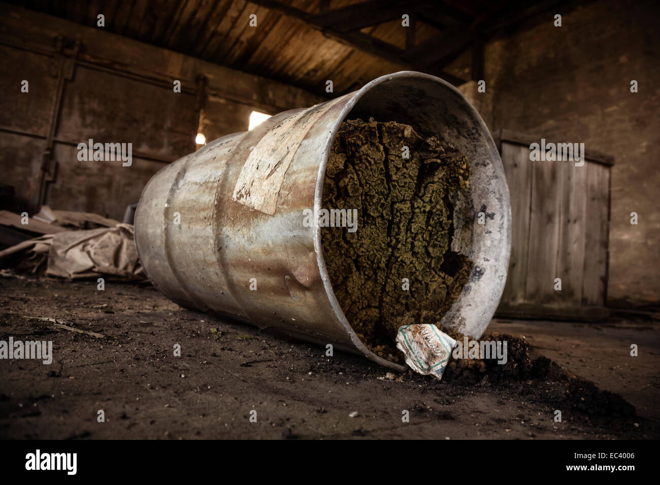 old metal drum stored in a dilapidated hall Stock Photo Alamy