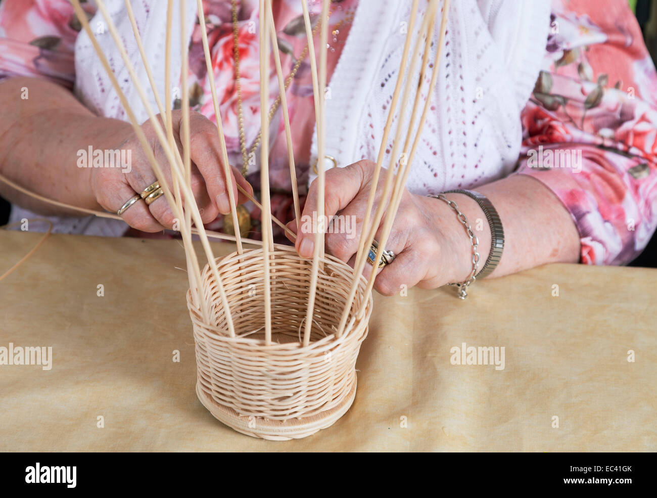 Hands a novel Semiorin in basket weaving Stock Photo