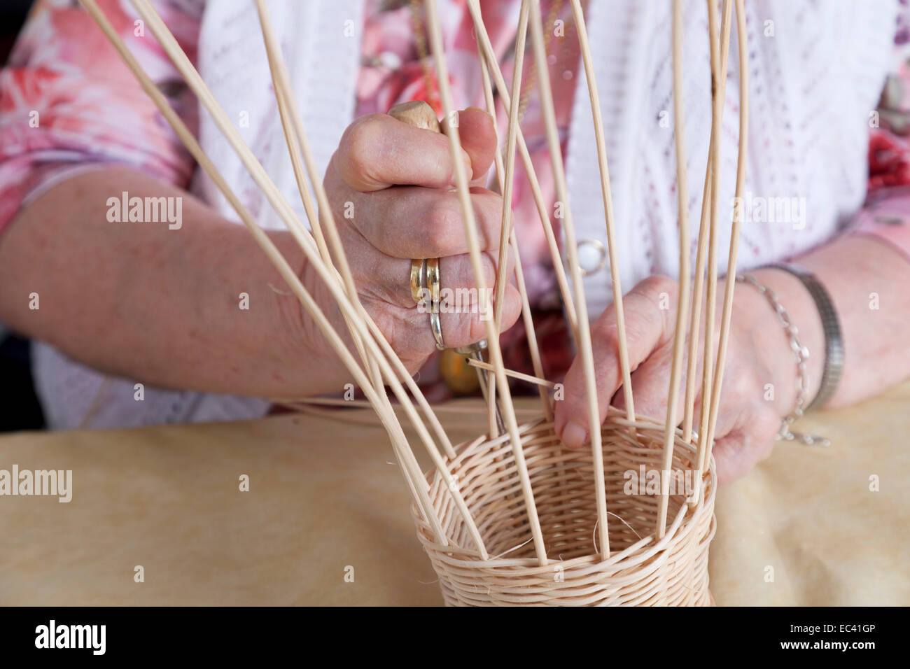 Hands a novel Seniorin in basket weaving Stock Photo