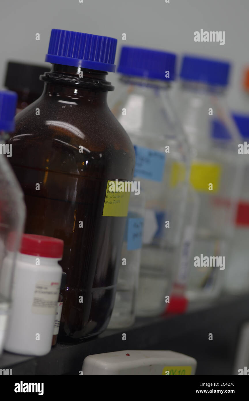 Buffer solutions on laboratory shelves Stock Photo Alamy