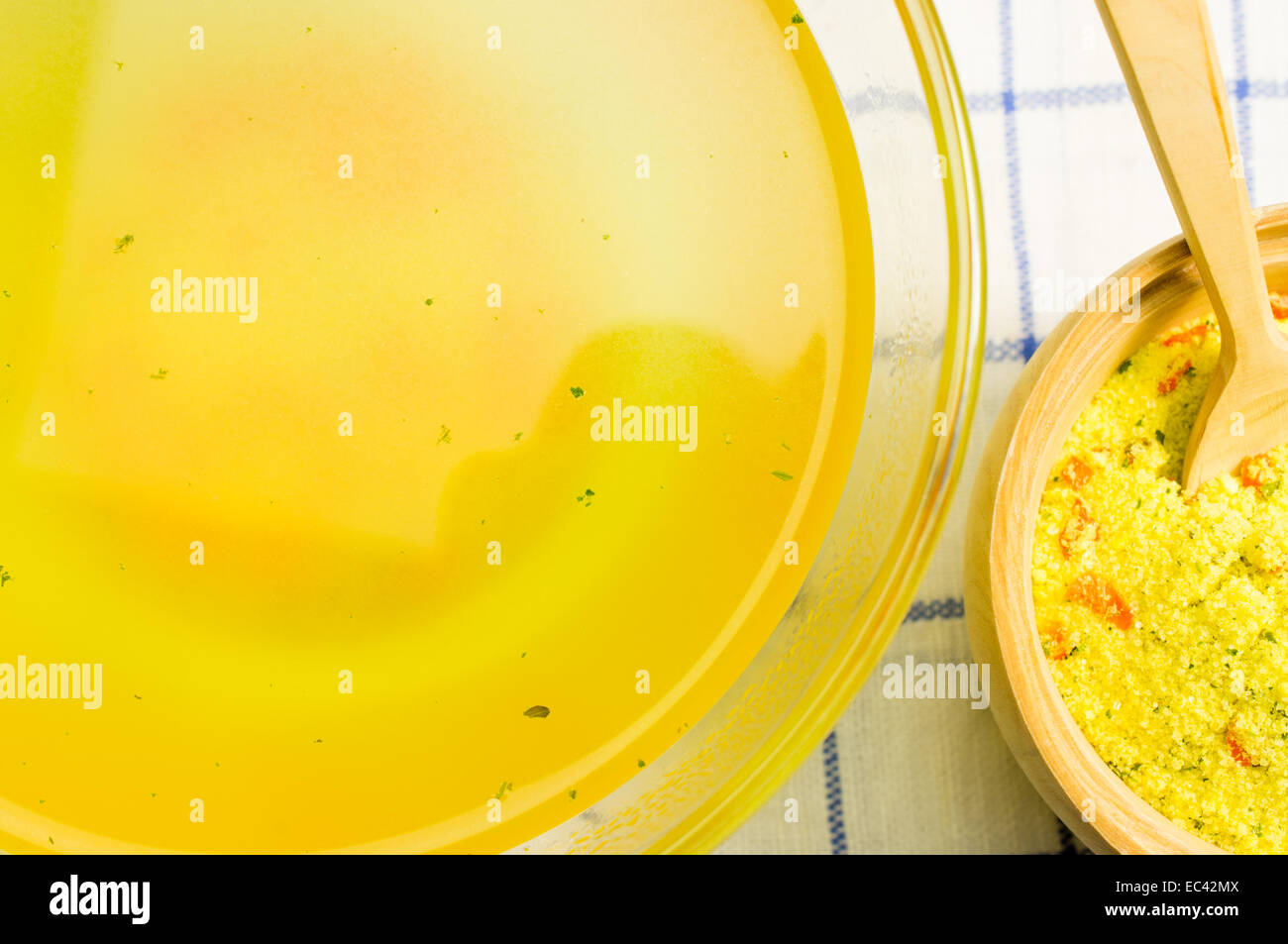 Broth, bouillon, clear soup? stock in a transparent bowl. Near bouillon