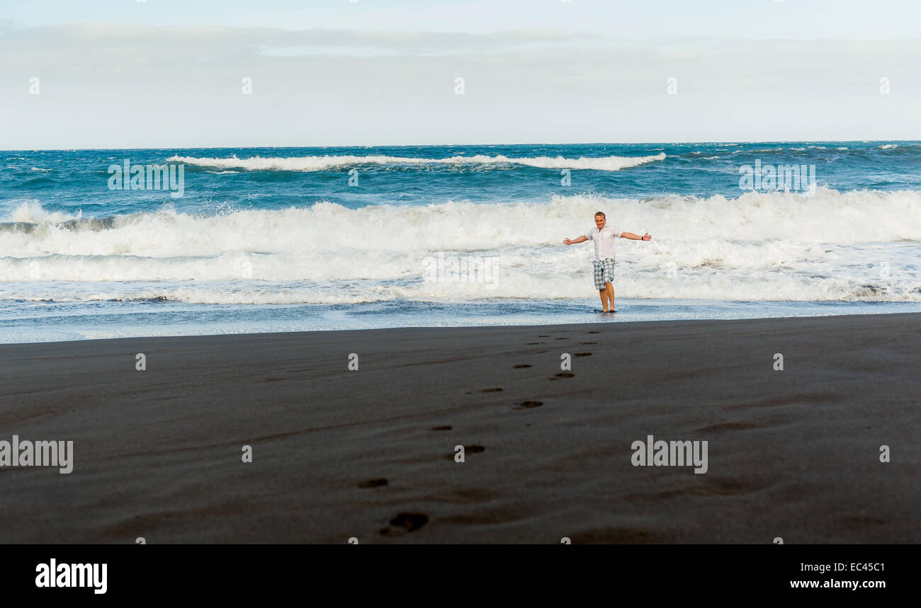 Happy black man walking hi-res stock photography and images - Alamy