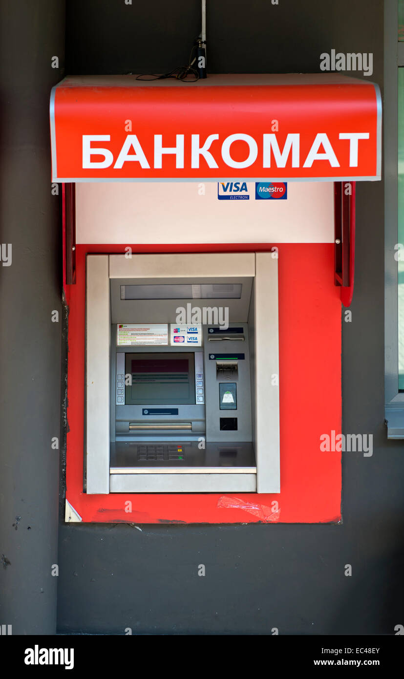Automatic teller machine ATM for Visa and Mastercard with label Bankomat in Russian, Almaty, Kazakhstan Stock Photo