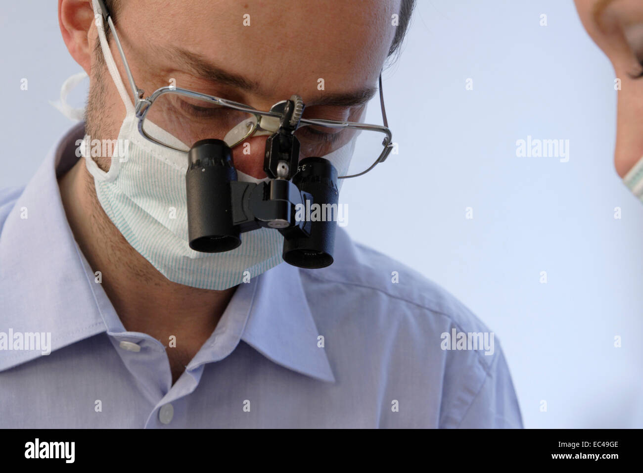 Dentist with microscope Stock Photo Alamy