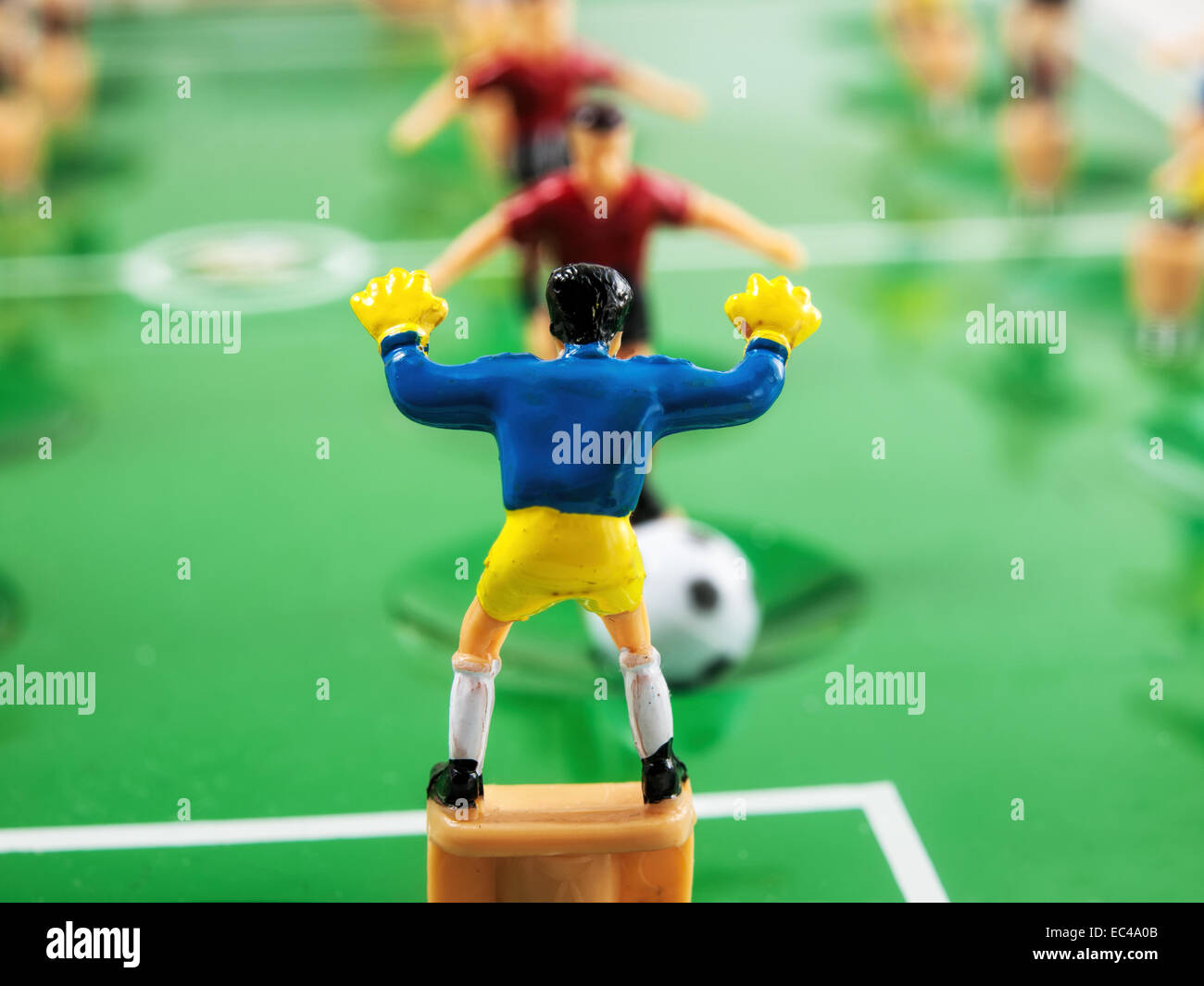 Toy football / soccer players in a fighting scene between the goalkeeper  and an opposing striker. Illustrating the game of Stock Photo - Alamy