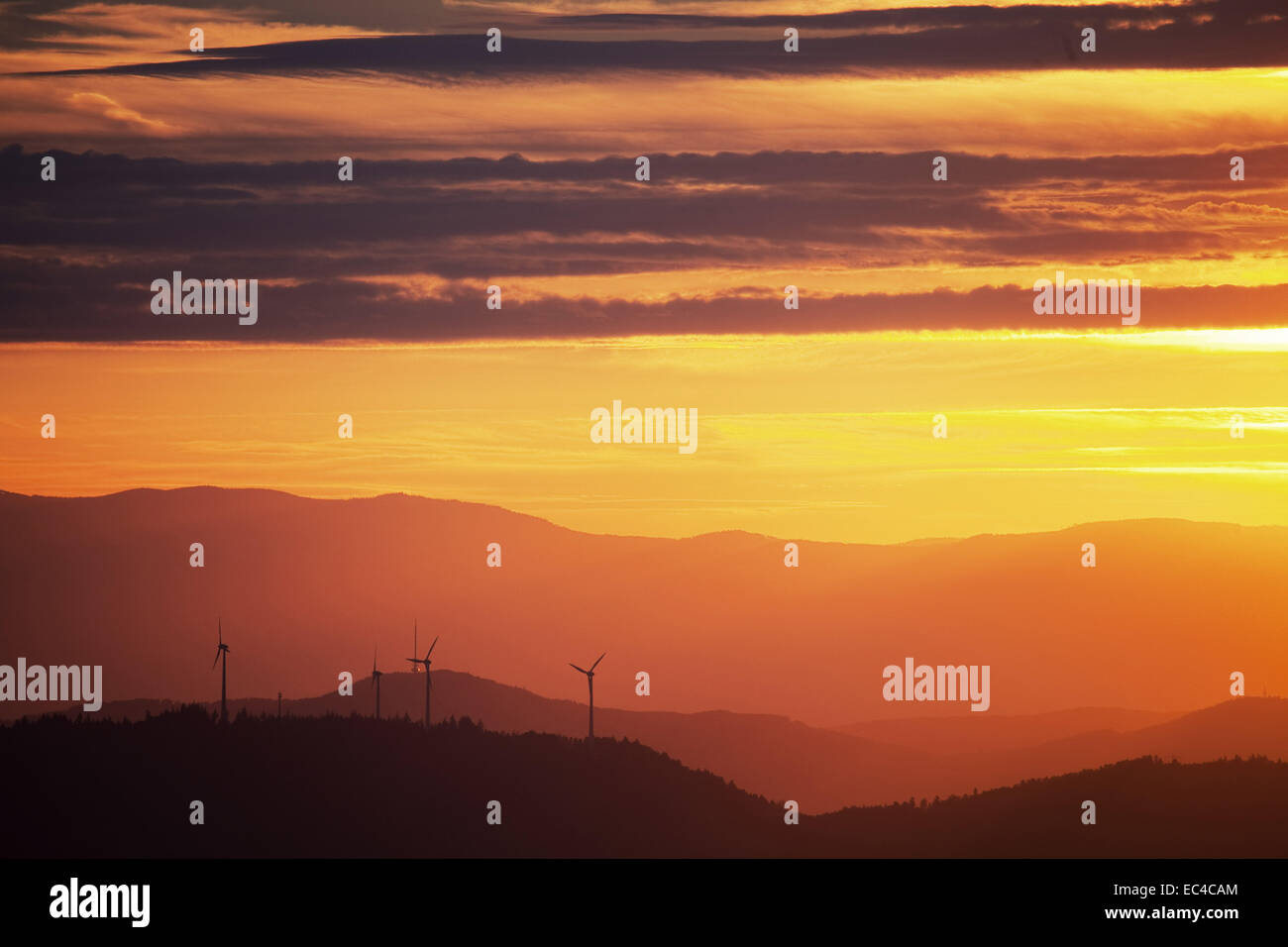 Wind turbines in Black Forest at sunset Stock Photo