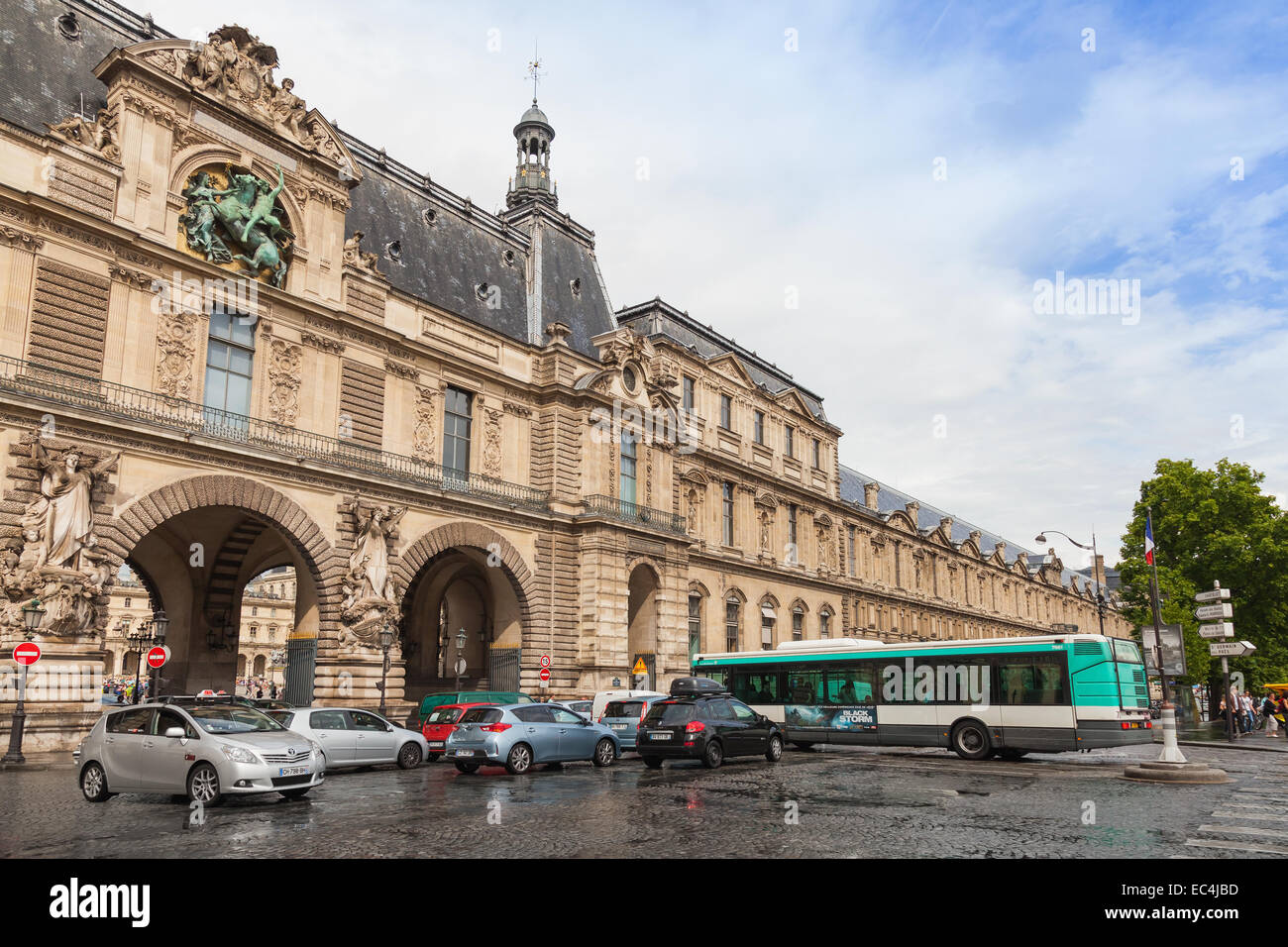 Paris, France - August 07, 2014: Facade of The Louvre museum with entrance gates, Paris Stock Photo
