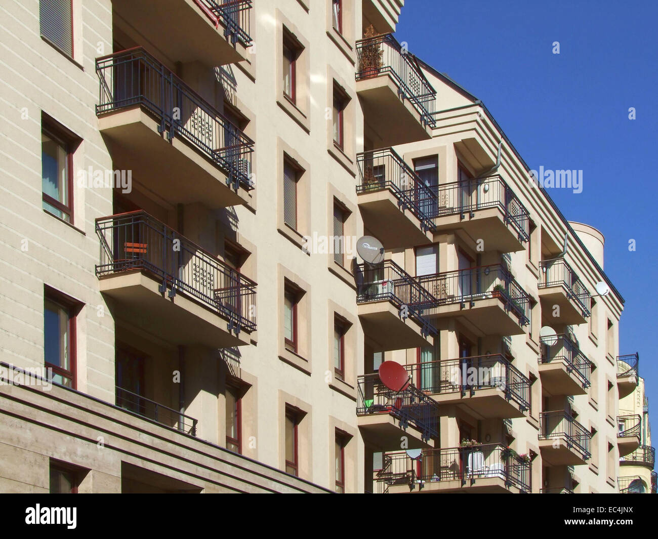 Apartment Building Architecture with Balconies and Satellite Dishes