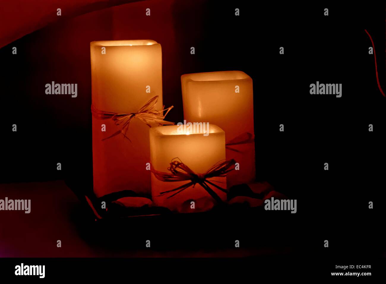Romantic candle light of three candles Stock Photo Alamy