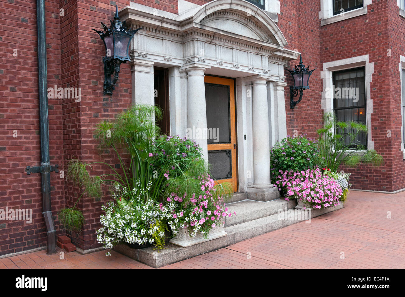 historic mansion entrance in jacobean architectural style decorated with plants in duluth minnesota Stock Photo