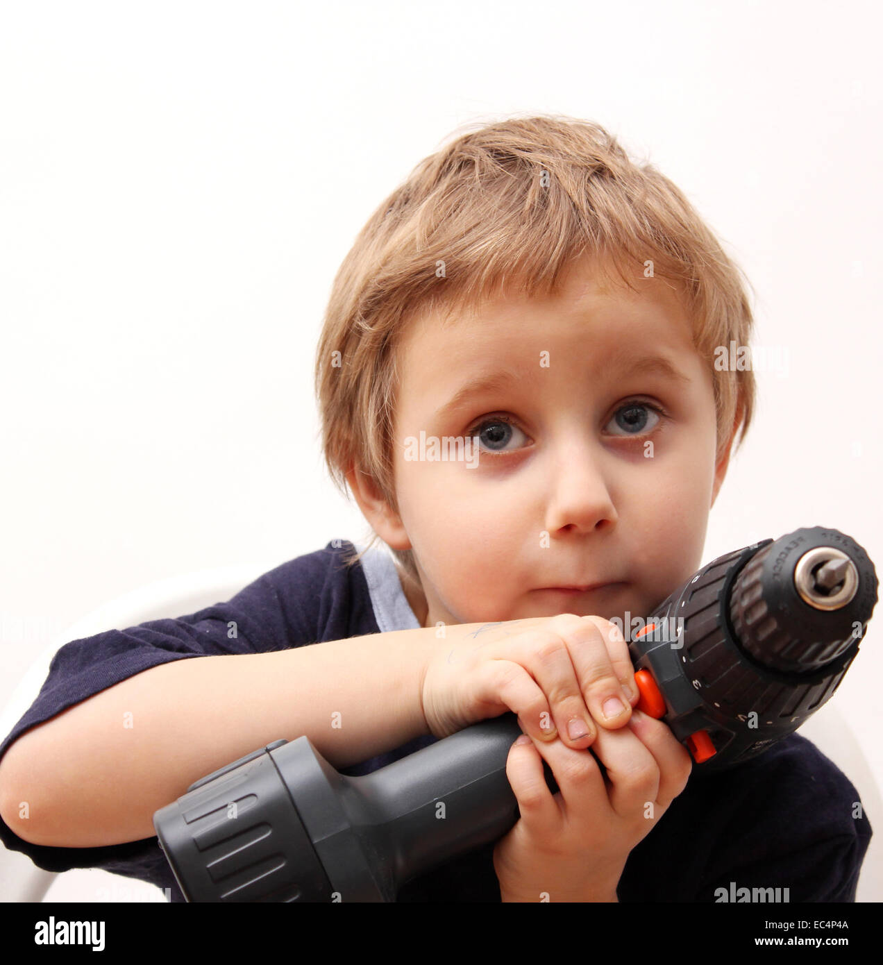 Child with Cordless screwdriver Stock Photo Alamy