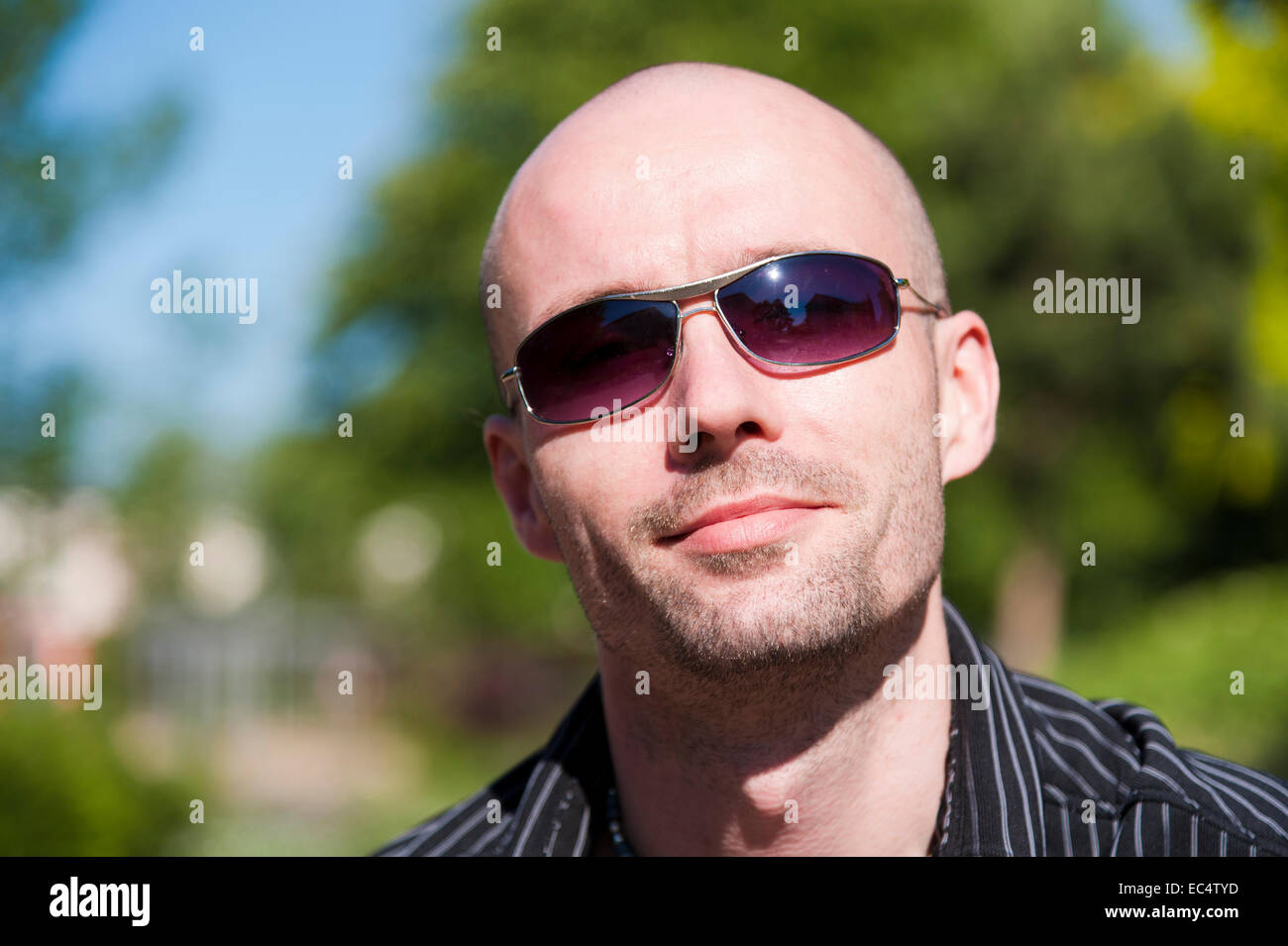 Portrait of a young man with sunglasses Stock Photo - Alamy