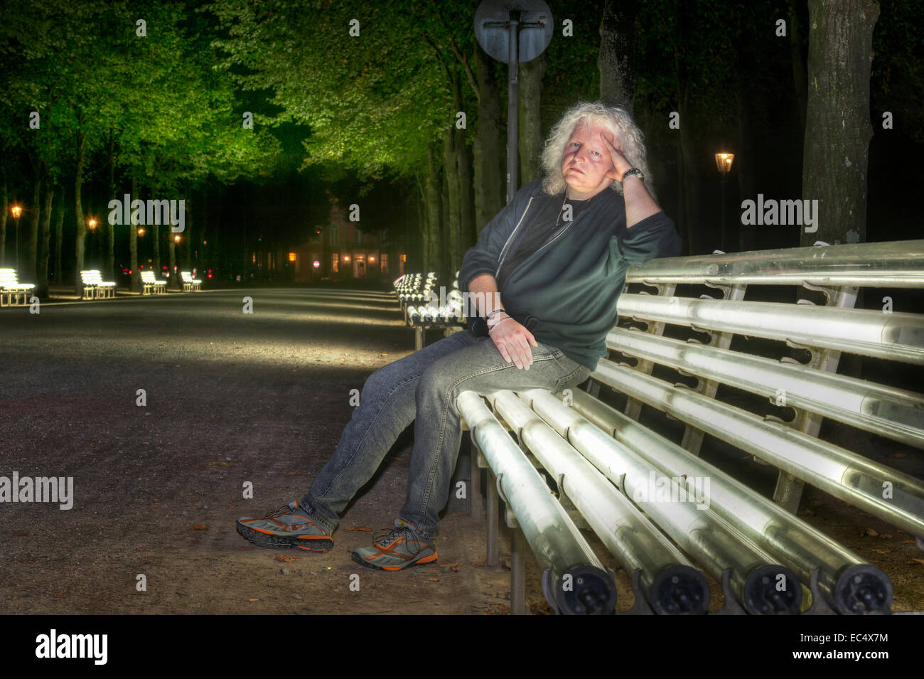 Man sits on a bench hi-res stock photography and images - Alamy