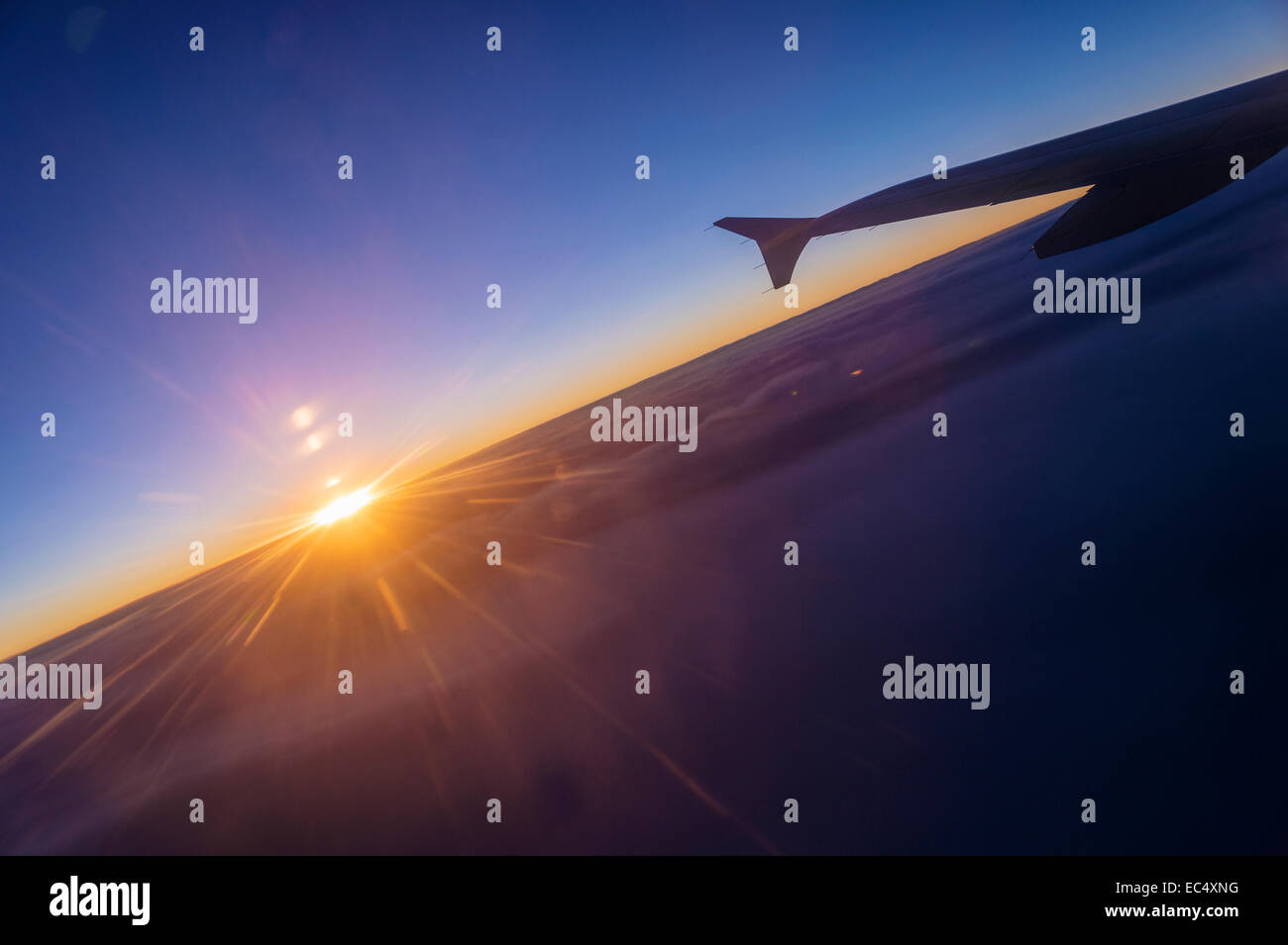 Sun rising above clouds hi-res stock photography and images - Alamy