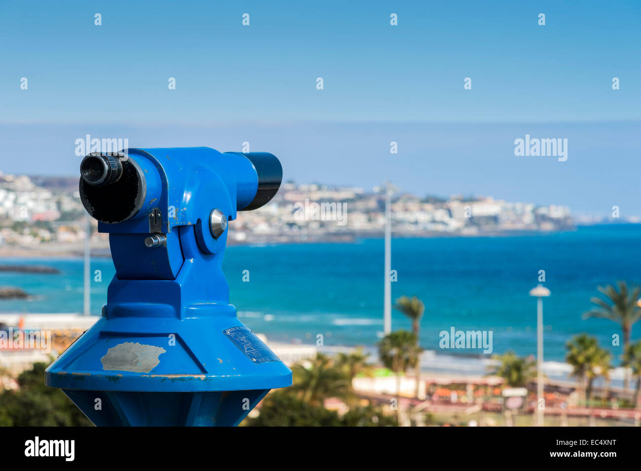 Coin-operated binoculars on the promenade of Playa del Ingles, overlooking San Agustin Stock Photo