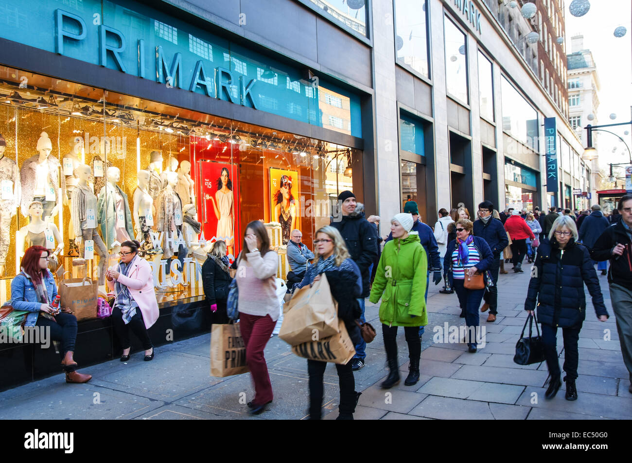 Shoppers outside Primark store on Oxford Street, London England United Kingdom UK Stock Photo