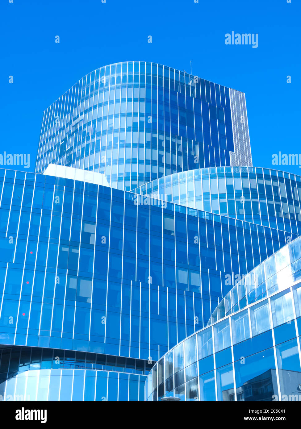 Modern office building with blue glass facade futuristic Stock Photo ...