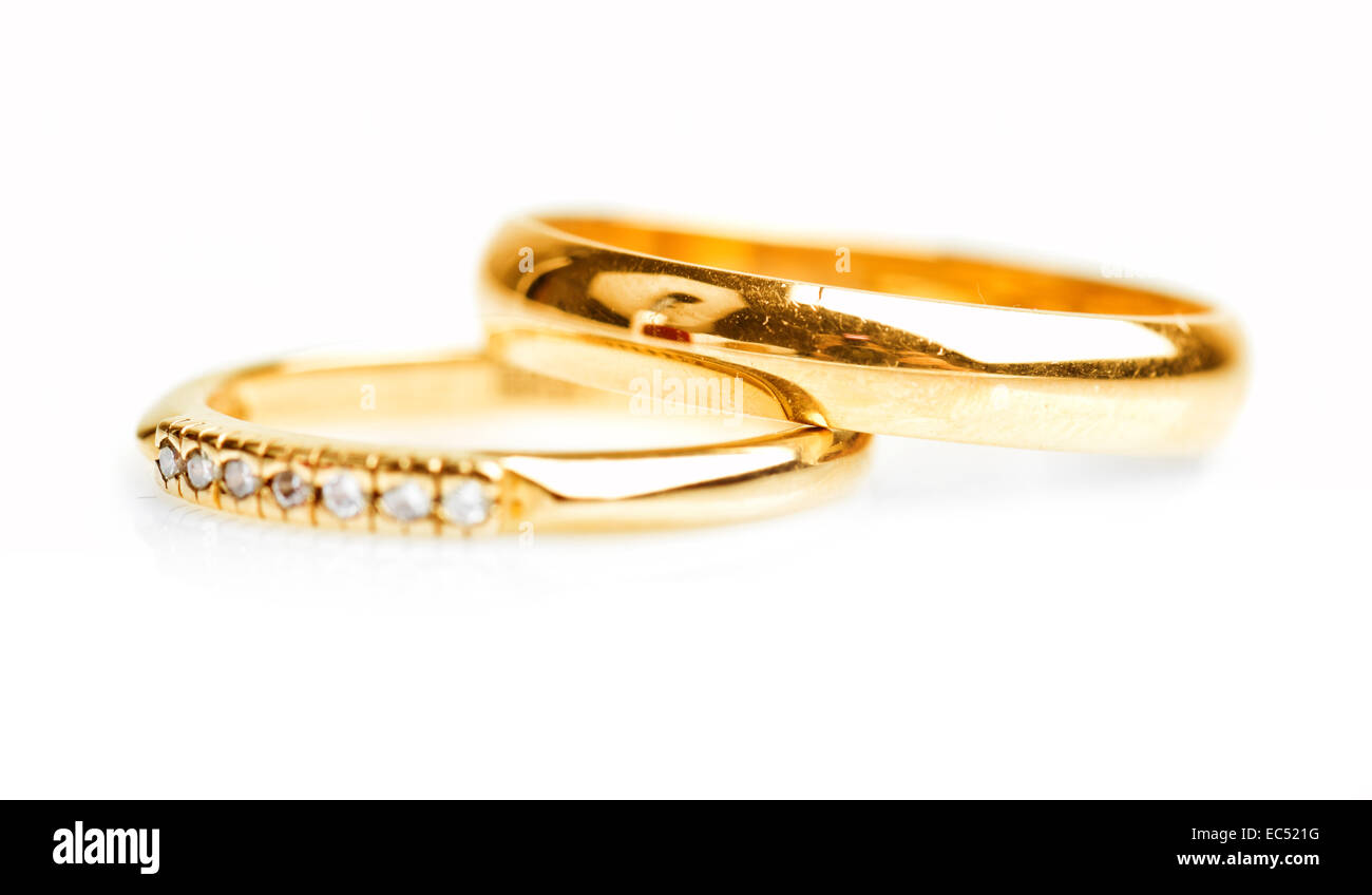Gold wedding rings isolated on white background Stock Photo - Alamy