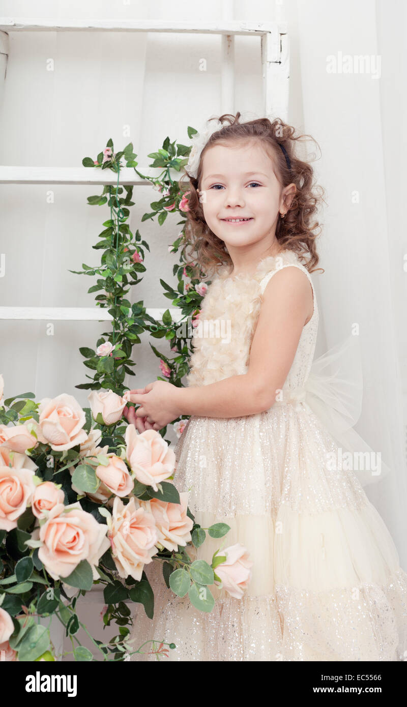 beautiful girl in an elegant dress with flowers Stock Photo