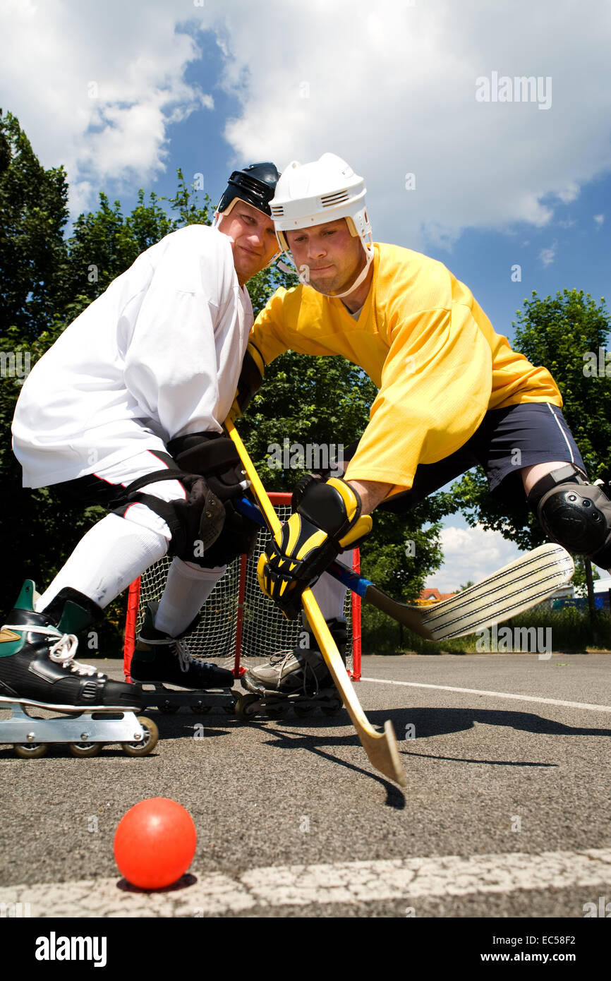 scenes of street hockey match Stock Photo