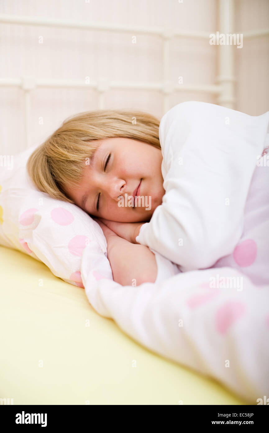 little girl sleeping in the bed Stock Photo - Alamy