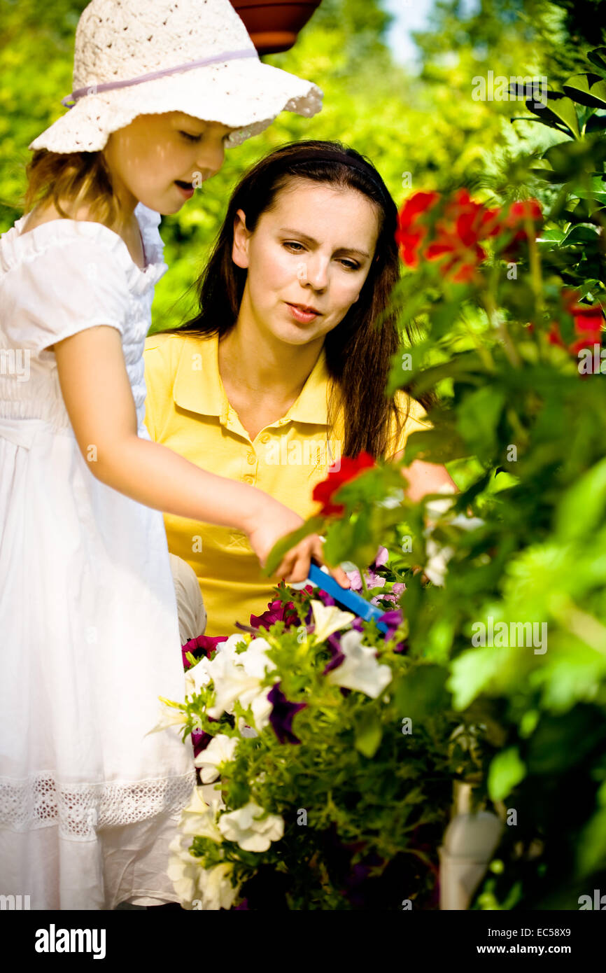 a 3,5 years old girl working in the garden Stock Photo - Alamy